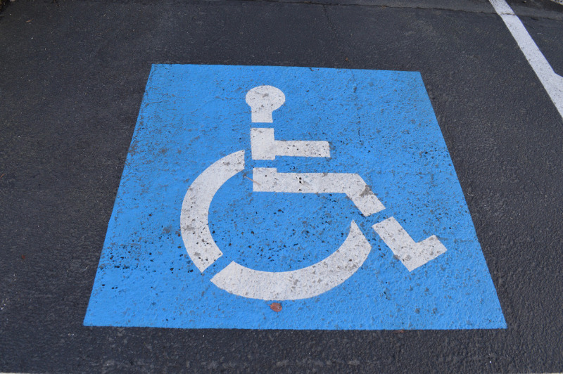 mobility parking spot with the blue wheelchair symbol