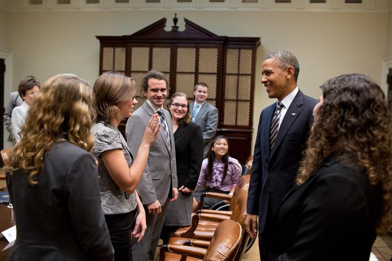 Barack Obama greeting people at an accessible meeting
