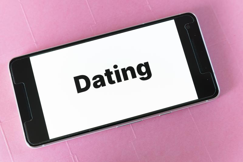 A phone with the word dating on it